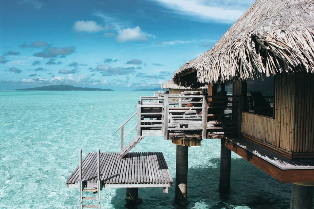 Brown Nipa Hut on Body of Water